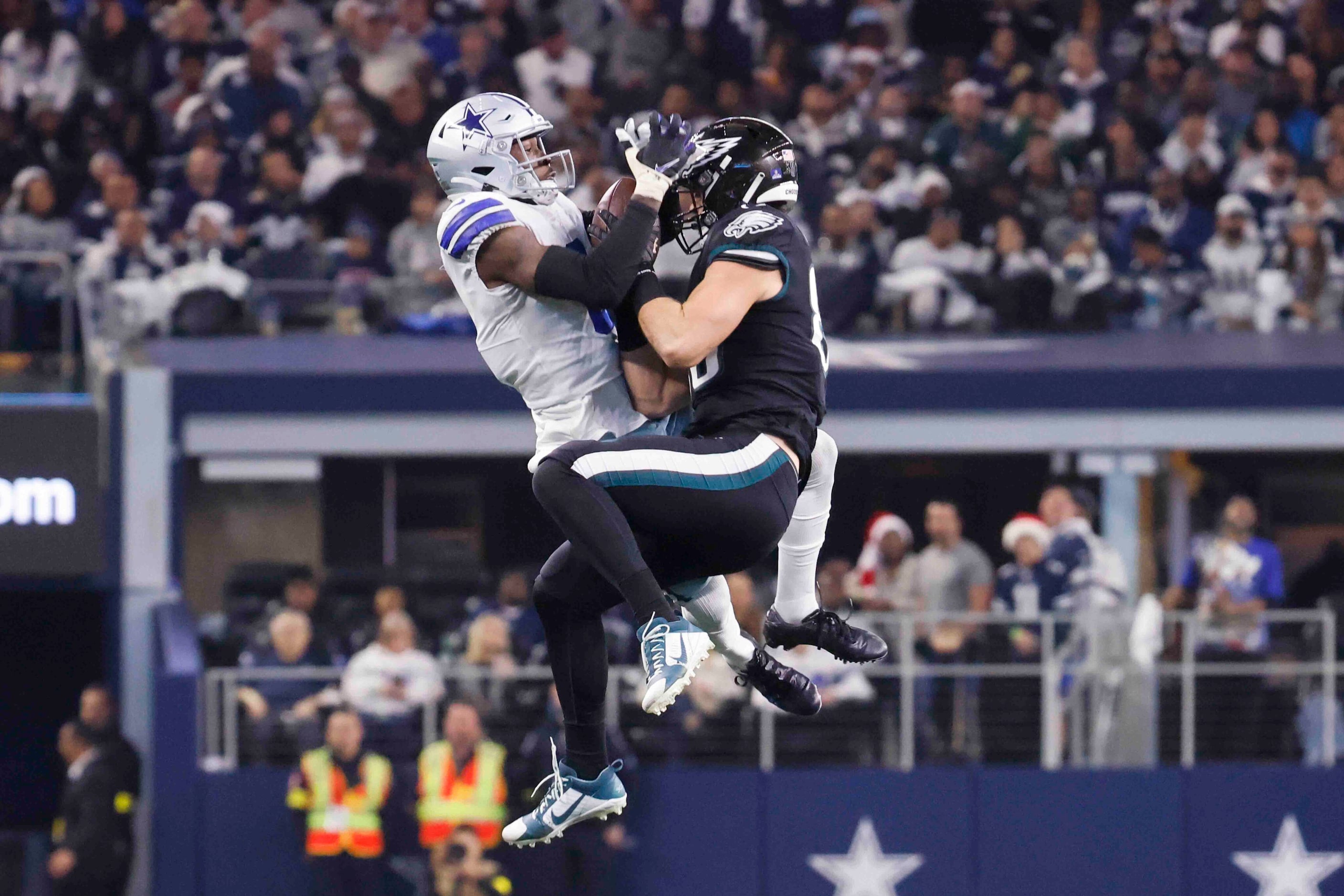 Philadelphia Eagles tight end Dallas Goedert (88), right, receives a pass as Dallas Cowboys...