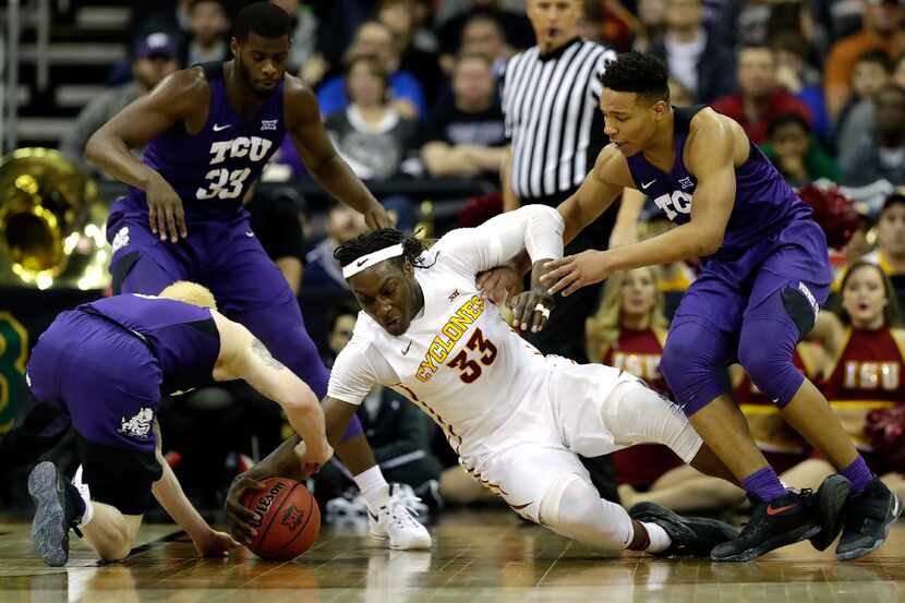 KANSAS CITY, MO - MARCH 10:  Solomon Young #33 of the Iowa State Cyclones dives for a loose...