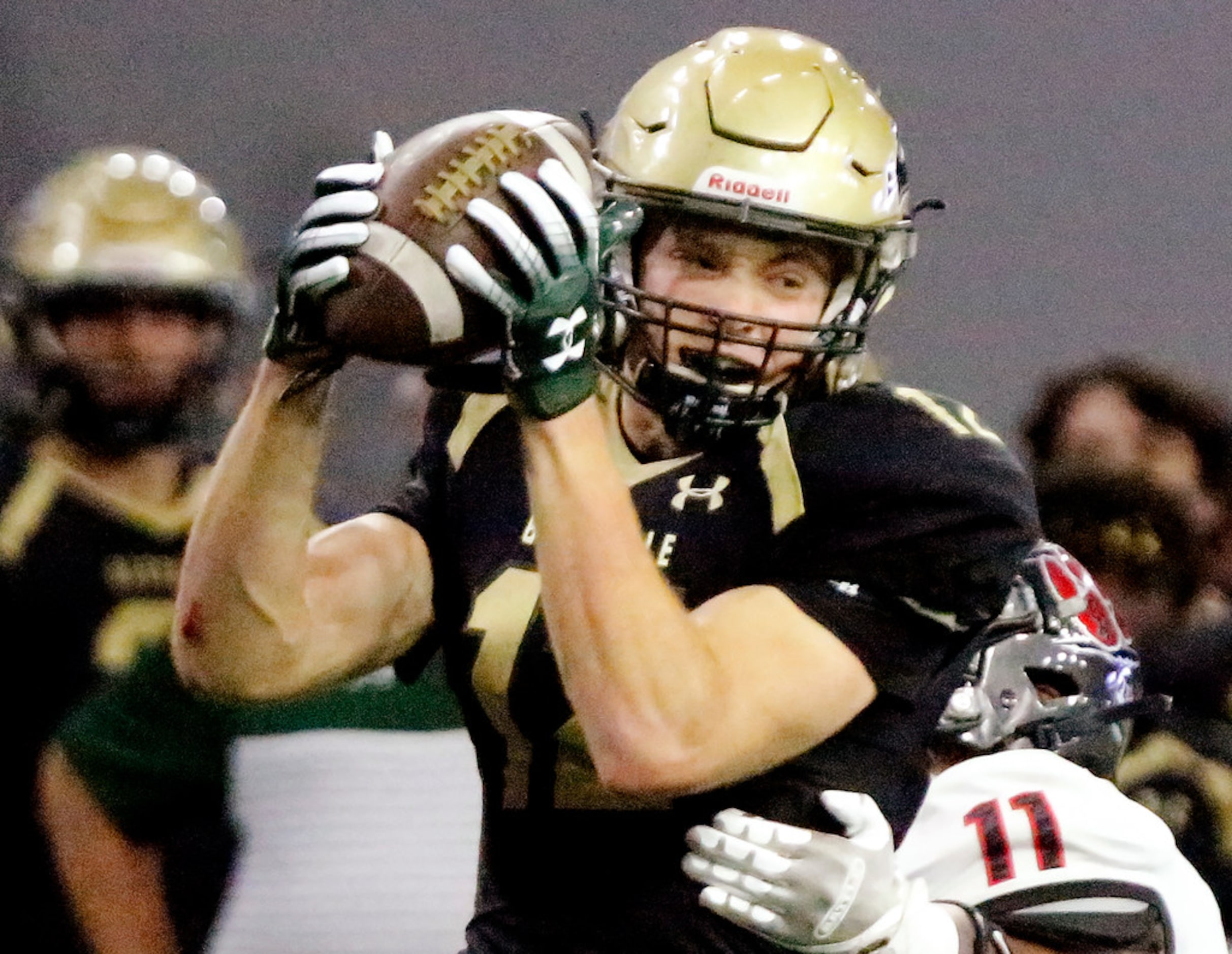 Colleyville Heritage High School wide receiver Brayden Gerlich (12)makes a catch on his...