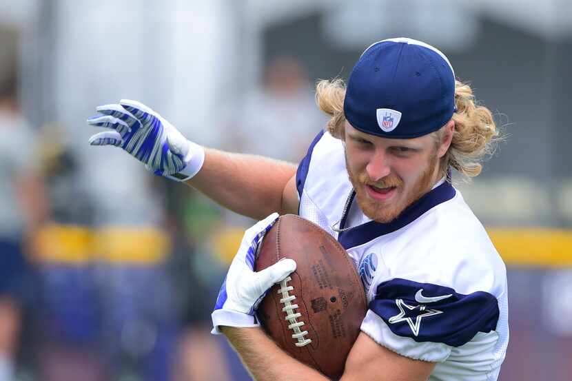 Receiver Cole Beasley makes a catch during the walk-thru practice at Dallas Cowboys training...