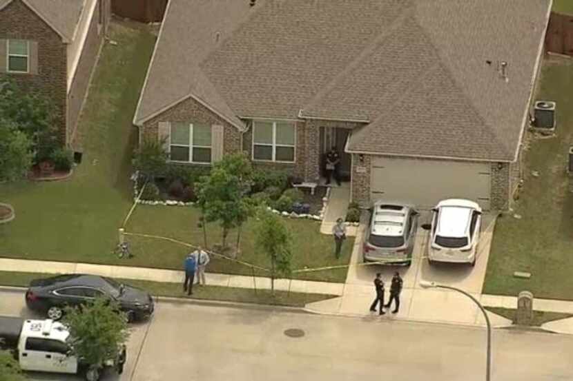 Fort Worth police at the scene of a house in the 2000 block of Speckle Drive, where four...