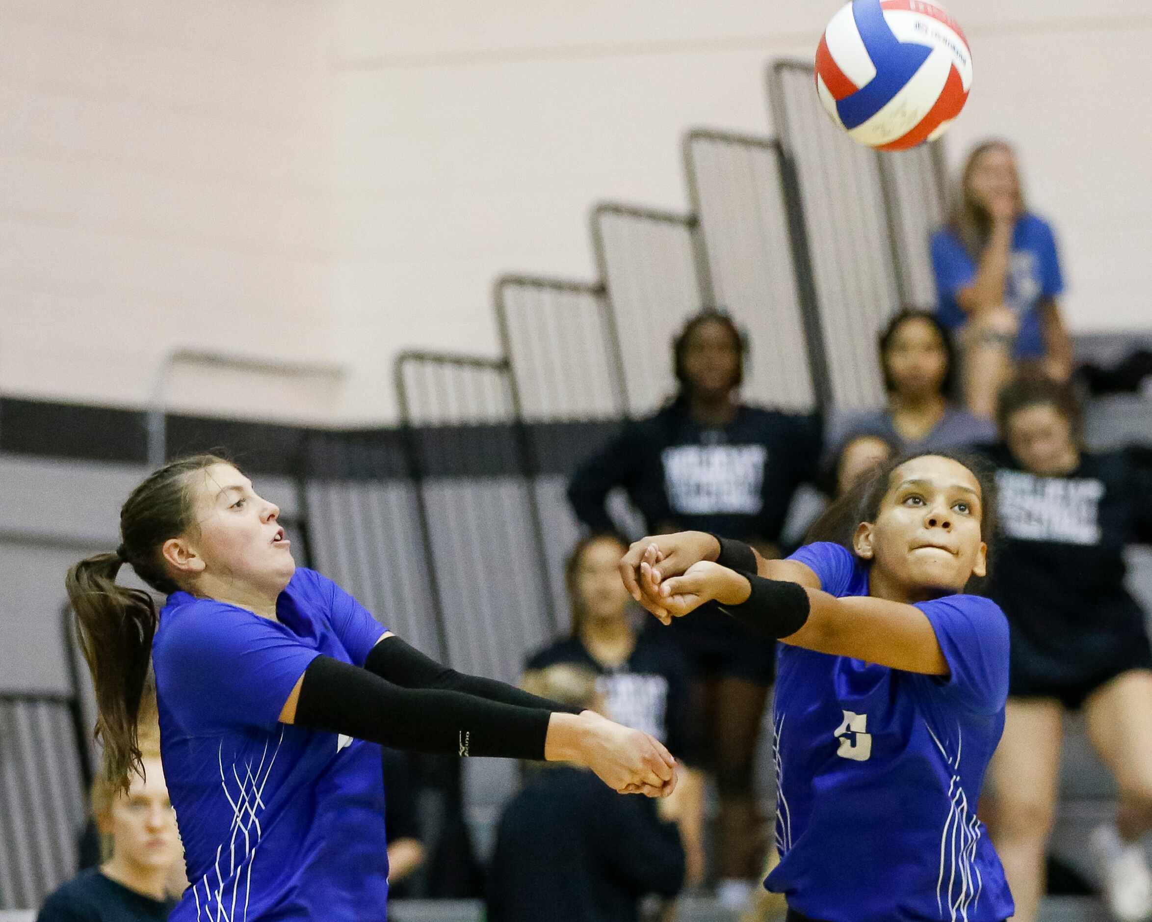 Denton Guyer defensive specialist Gracey Campbell (left) and outside hitter Kyndal Stowers...