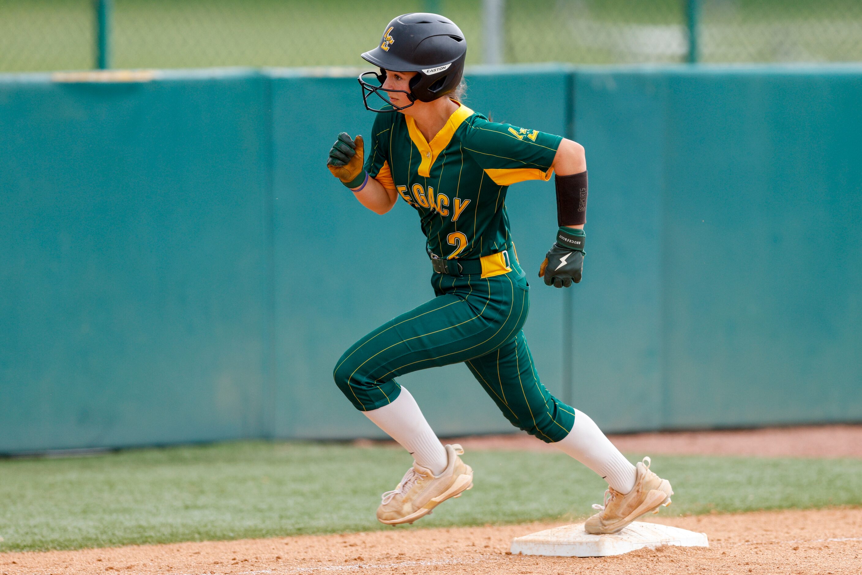 Frisco Legacy Christian infielder Lynlee Kennedy (2) rounds third base as she scores a run...