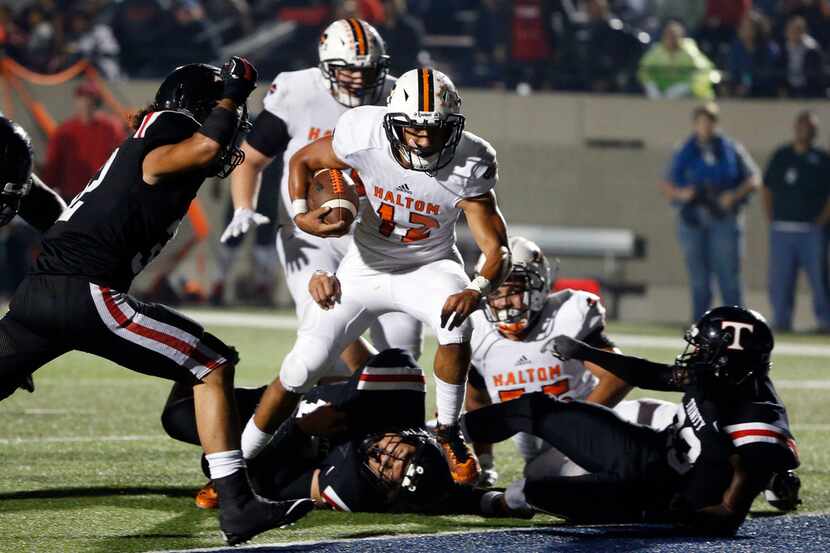 Haltom quarterback Michael Black runs for a touchdown during a 48-34 win over Euless Trinity...