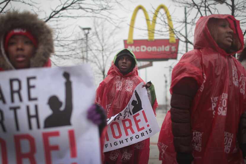 McDonald's workers and their supporters protest outside of a company-owned restaurant on...