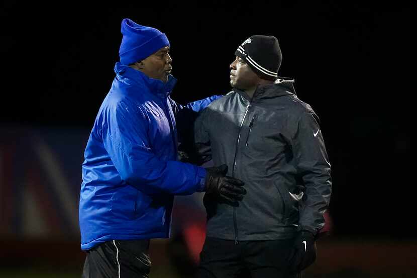 DeSoto head coach Claude Mathis (right) hugs Duncanville head coach Reginald Samples after...