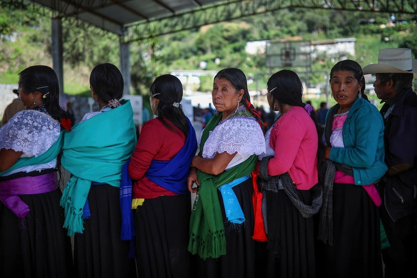 In this July 1, 2018 photo, people wait to vote during general elections in the indigenous...