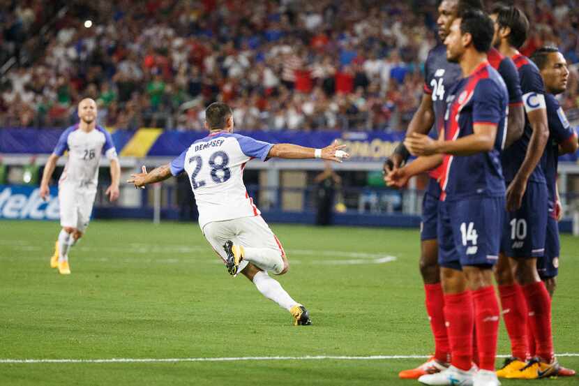 USA midfielder Clint Dempsey celebrates after scoring on a free kick in the 82nd minute of a...