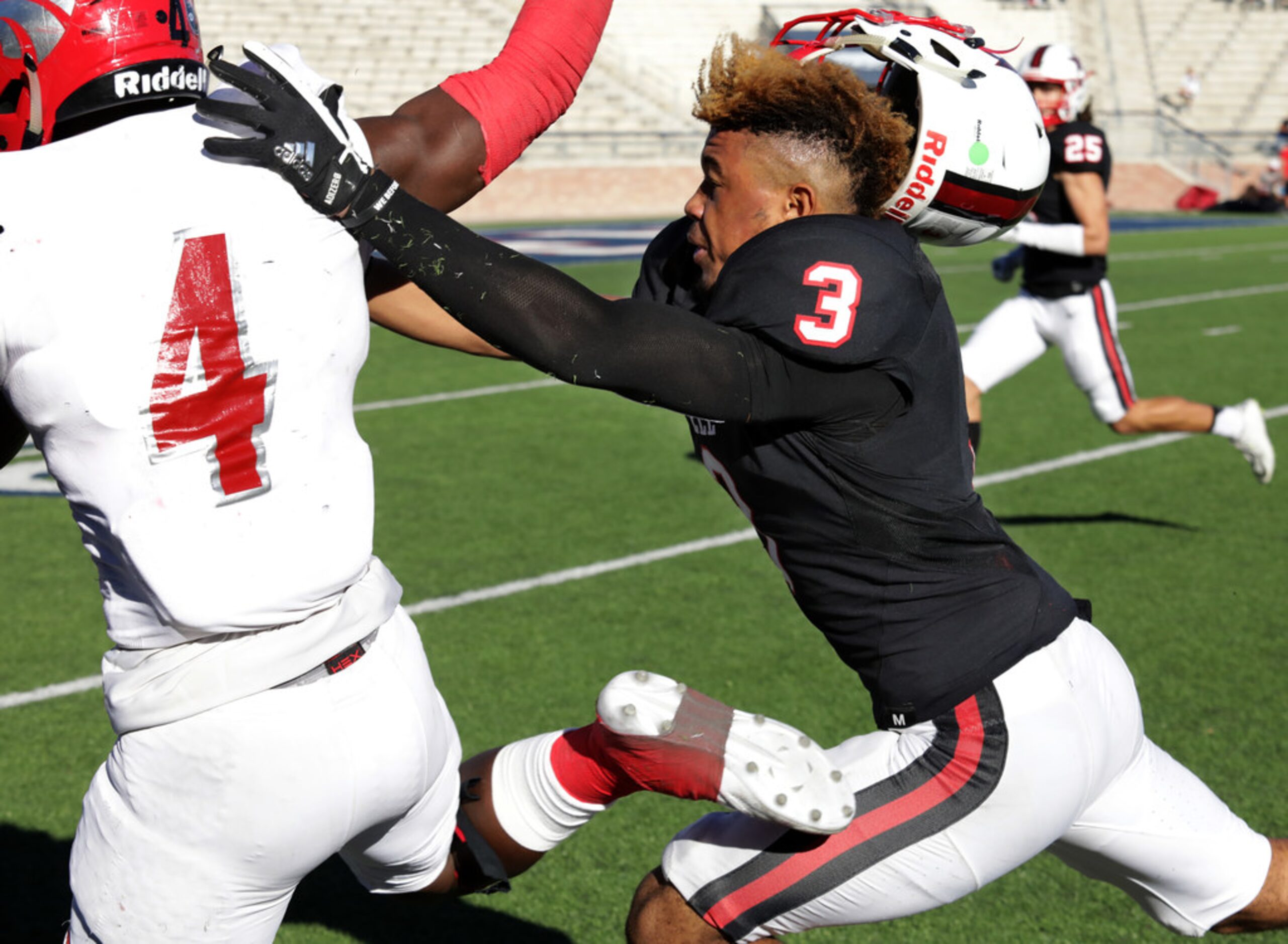 Horn player 4, Esaias Taylor, breaks past Coppell player 3, Jonathan McGill, in a Class 6A...