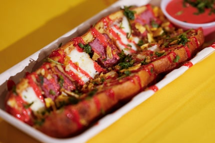 Dominican Fritura Dog is essentially a corny dog with salami and cheese inside.