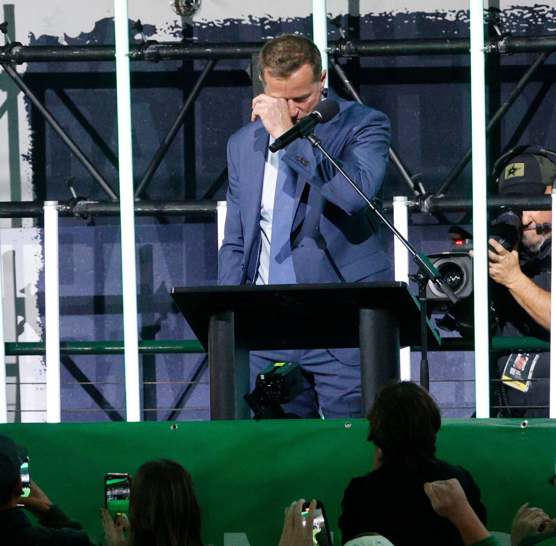 Dallas Stars legend Mike Modano shows his emotion as he speaks during the unveiling ceremony...