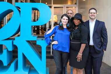 Four attendees of The Austin Street Center's No Place Like Home 2020 fundraiser stand at the...