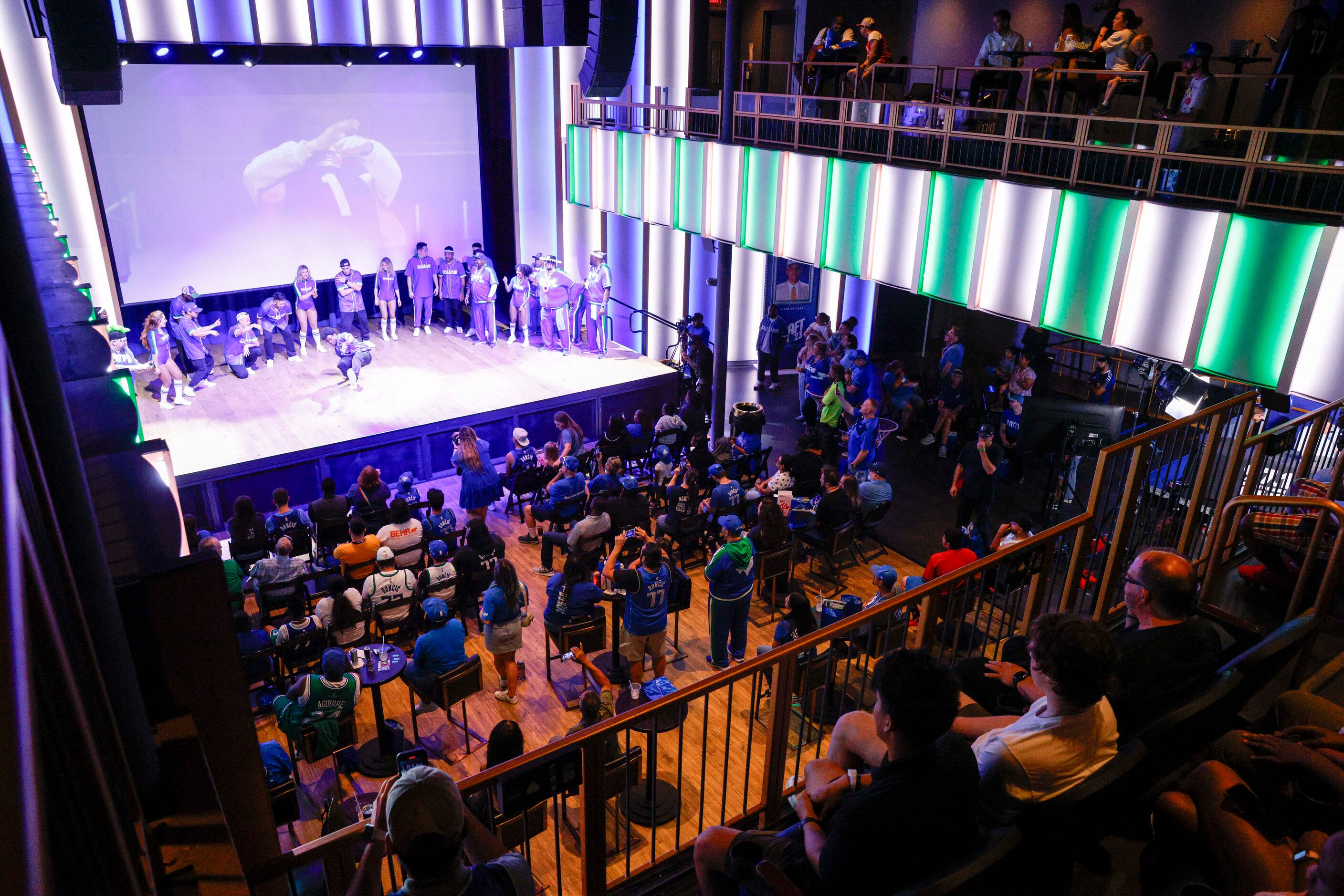 Dallas Mavericks fans watch a performance by the D-Town Crew, Maniaacs and Mavs Breakers...