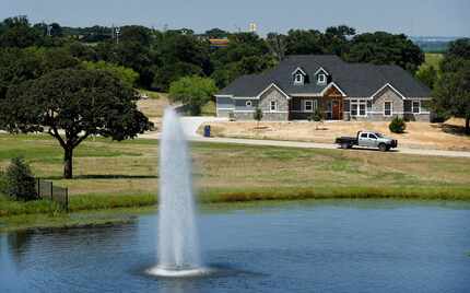 New homes are being built around a water feature in the Forrest Hills neighborhood in the...