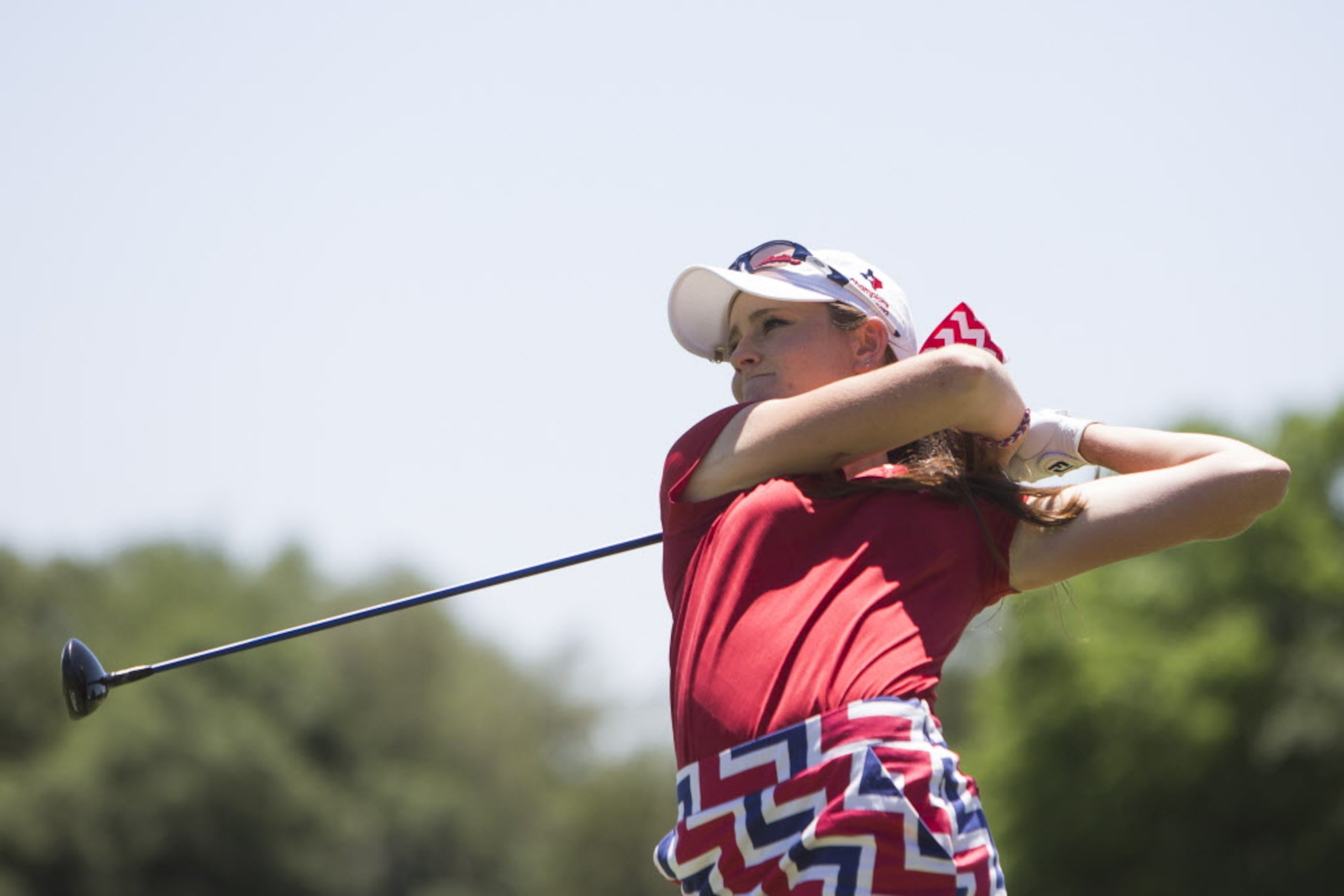 Allen senior Maddie Szeryk tees off on the first hole during the UIL 5A State Golf...