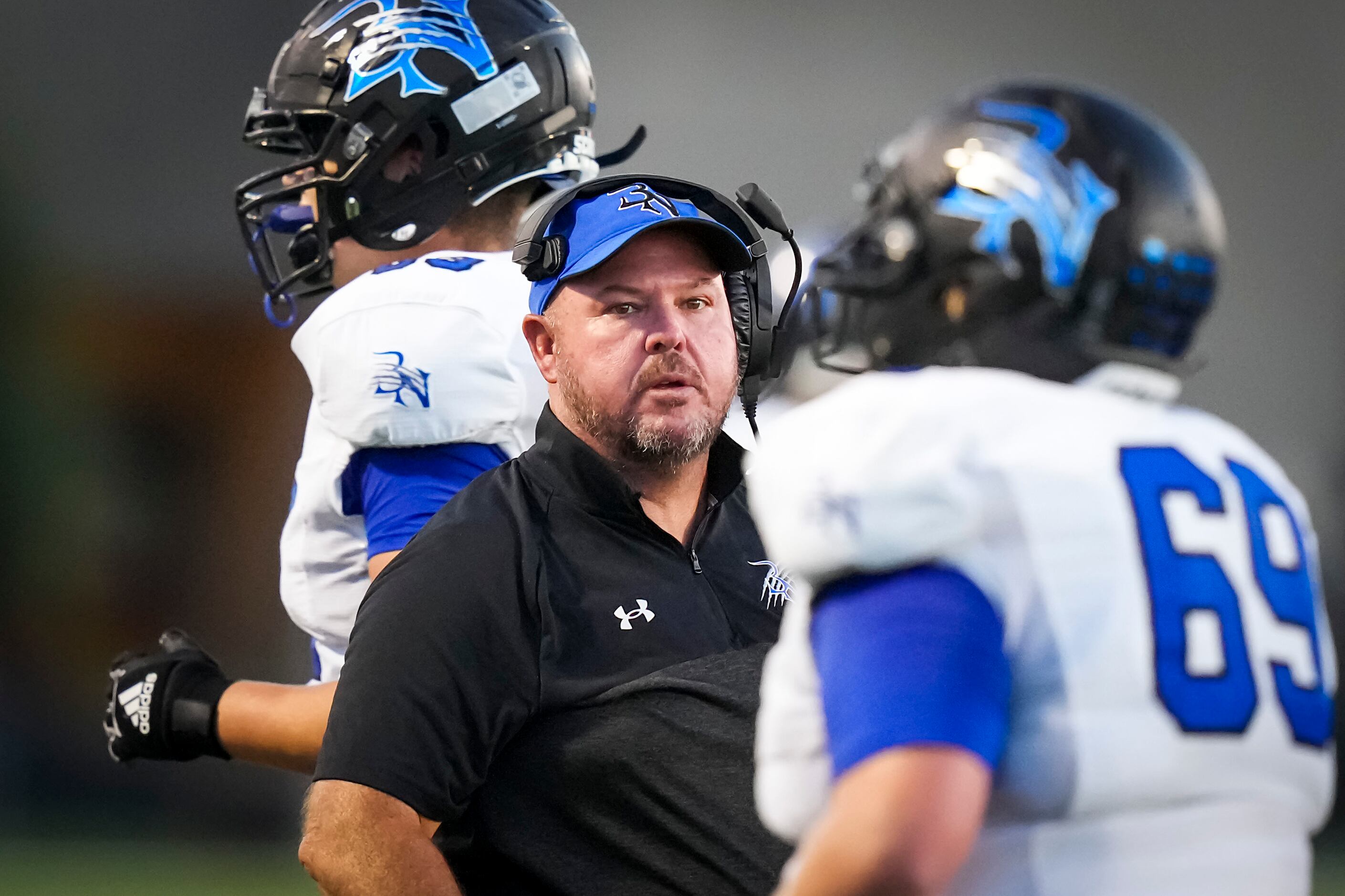 Trophy Club Byron Nelson head coach Travis Pride works on the sidelines during the first...