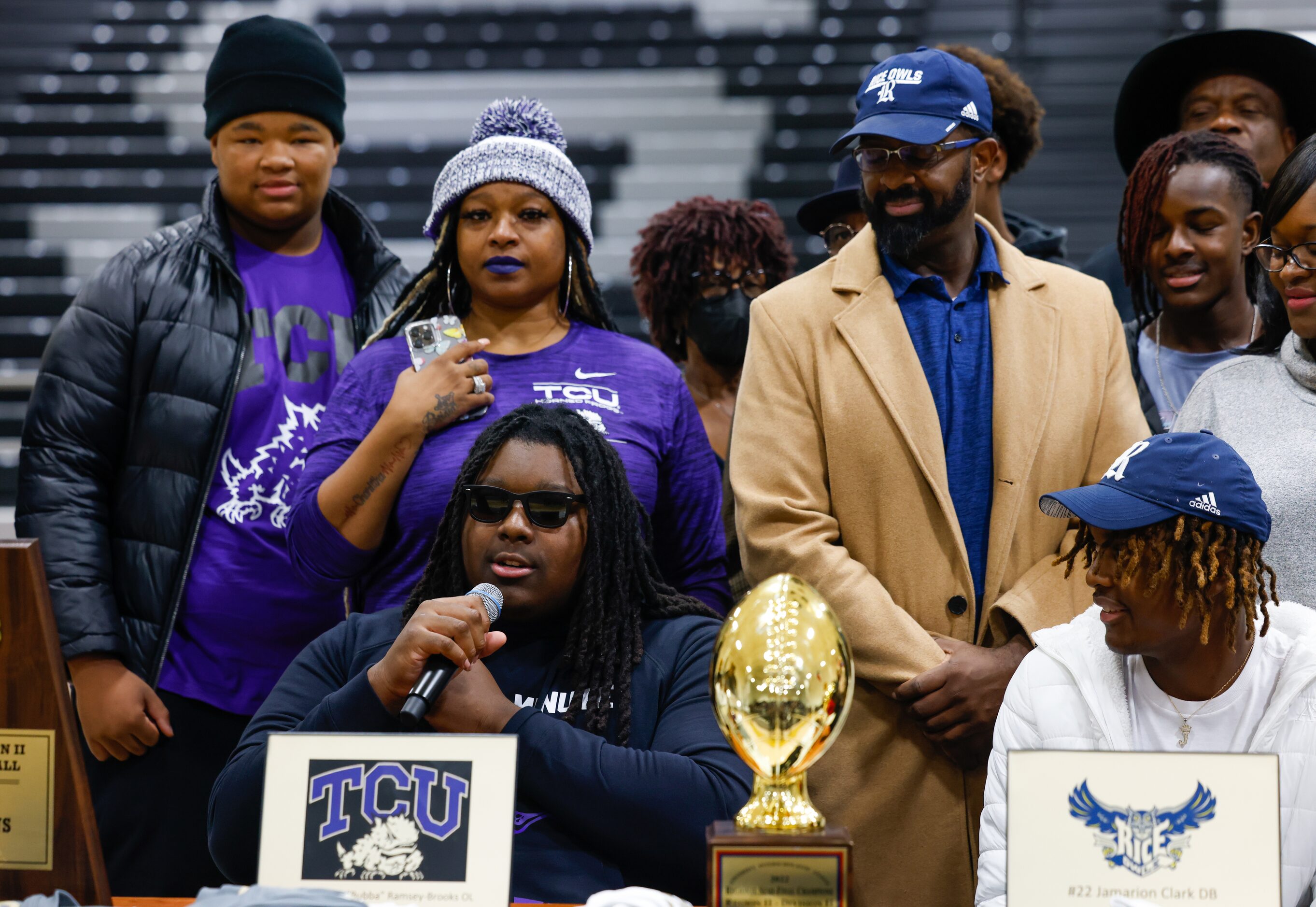 South Oak Cliff football player Brione Ramsey-Brooks (front left) shares his intent to play...