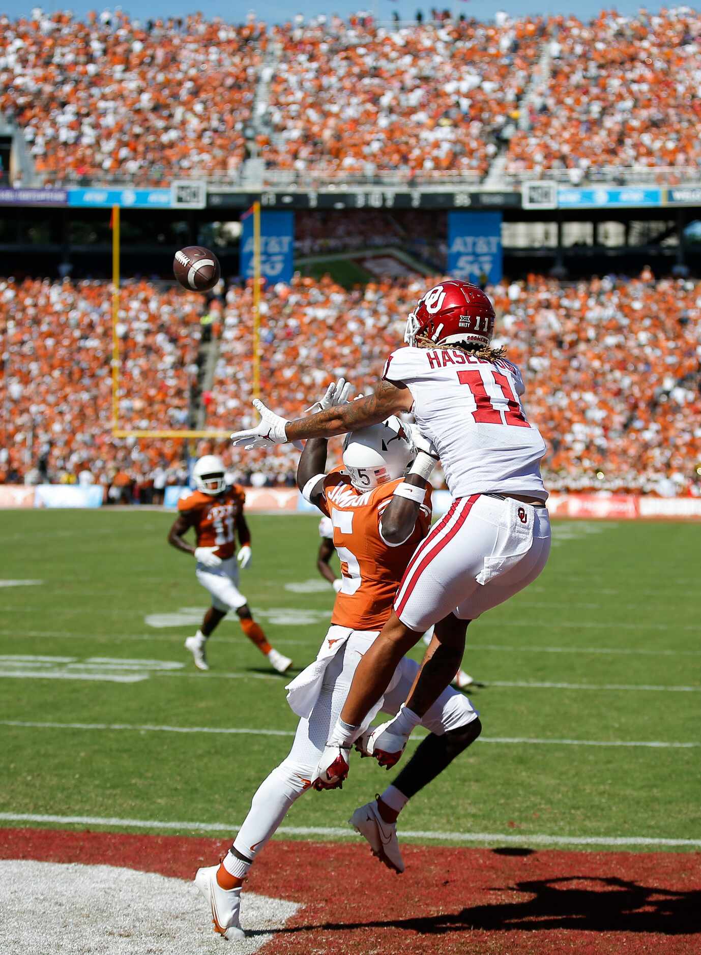 Texas defensive back D'Shawn Jamison (5) blocks a pass in the end zone intended for Oklahoma...