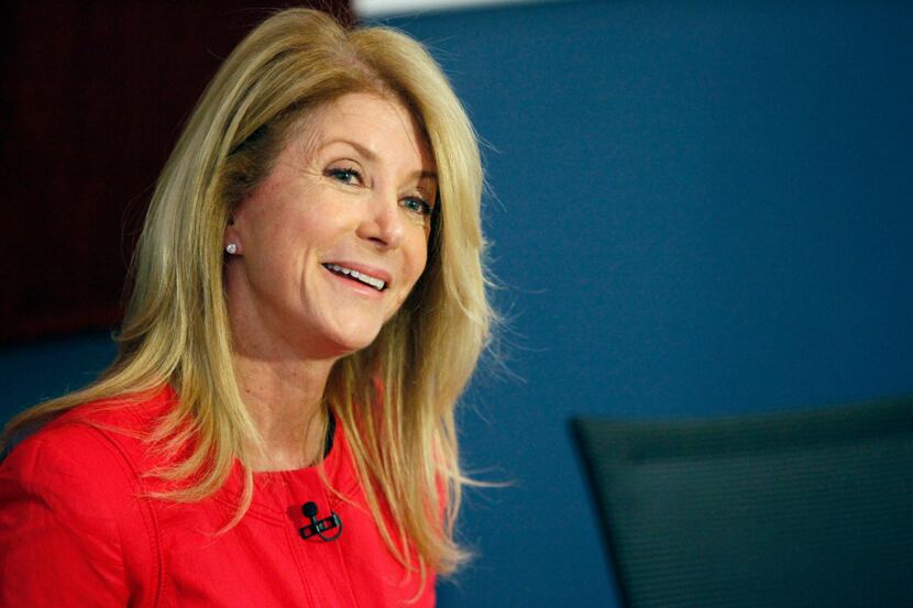 Wendy Davis, former Texas state senator and 2014 candidate for Texas governor, answers a...