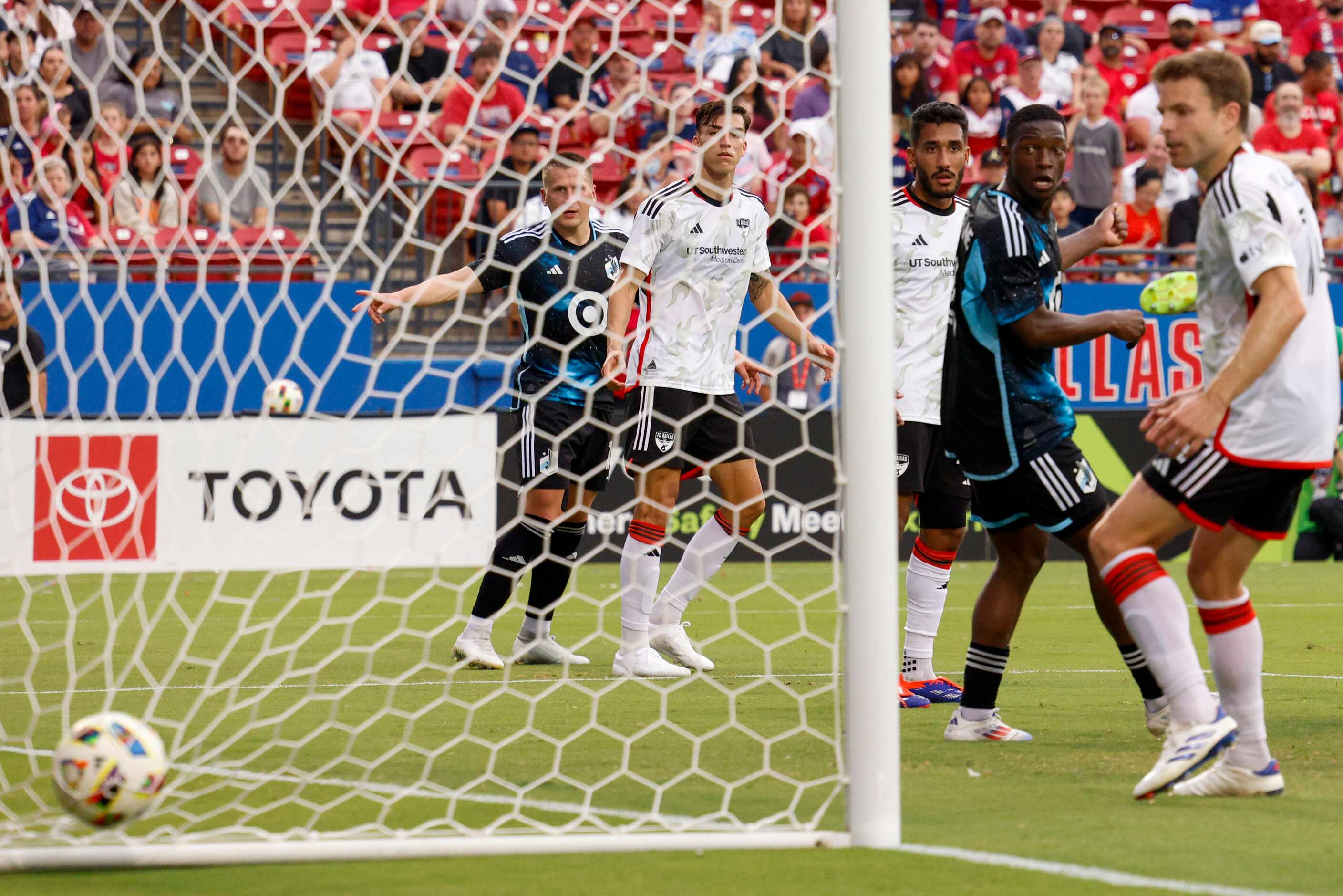 Minnesota United forward Bongokuhle Hlongwane (21) watches as the ball lands in the back of...
