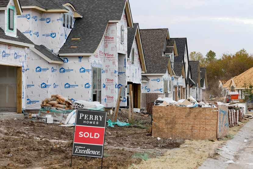 Permits for new D-FW homes fell by almost 14% in October. (Elias Valverde II/The Dallas...