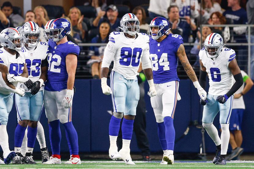 Dallas Cowboys defensive end DeMarcus Lawrence (90) celebrates after a stop on fourth down...