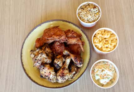 A family platter of fried and grilled chicken, with rice, macaroni and coleslaw at Pollo...