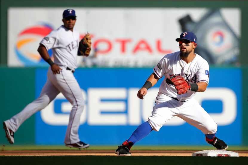 Texas Rangers shortstop Elvis Andrus (1) and second baseman Rougned Odor (12) are pictured...