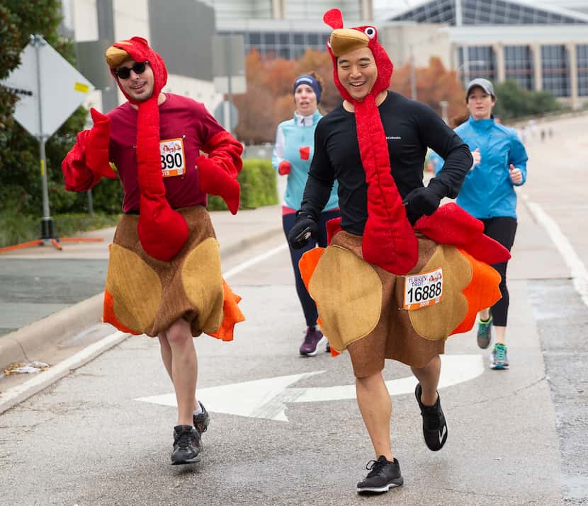 Runners wore turkey costumes during 2019's YMCA Turkey Trot 8-mile race in downtown Dallas. 