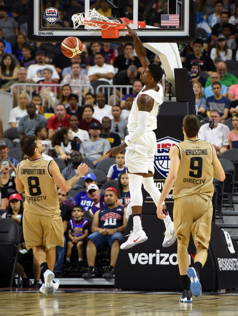 LAS VEGAS, NV - JULY 22:  Paul George #13 of the United States dunks in front of Nicolas...