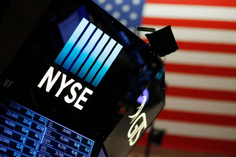 A logo for the New York Stock Exchange is displayed above the trading floor, Wednesday, Dec....