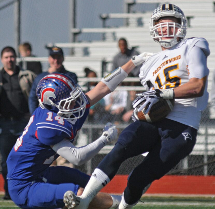 TCA - Addison senior Patrick Rea (14) pulls down Prestonwood sophomore Jonathan Heasley (15)...