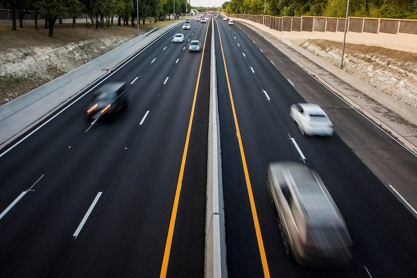 Traffic is seen flowing on the Dallas North Tollway looking north from the bridge on Walnut...