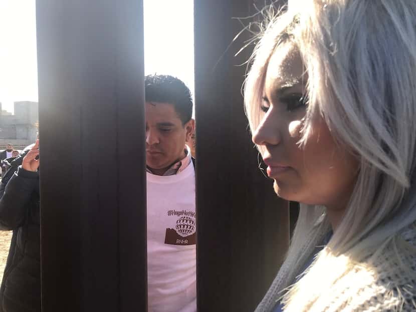 Lilliana Dominguez, 27, traveled from Houston to the border fence near El Paso to marry her...