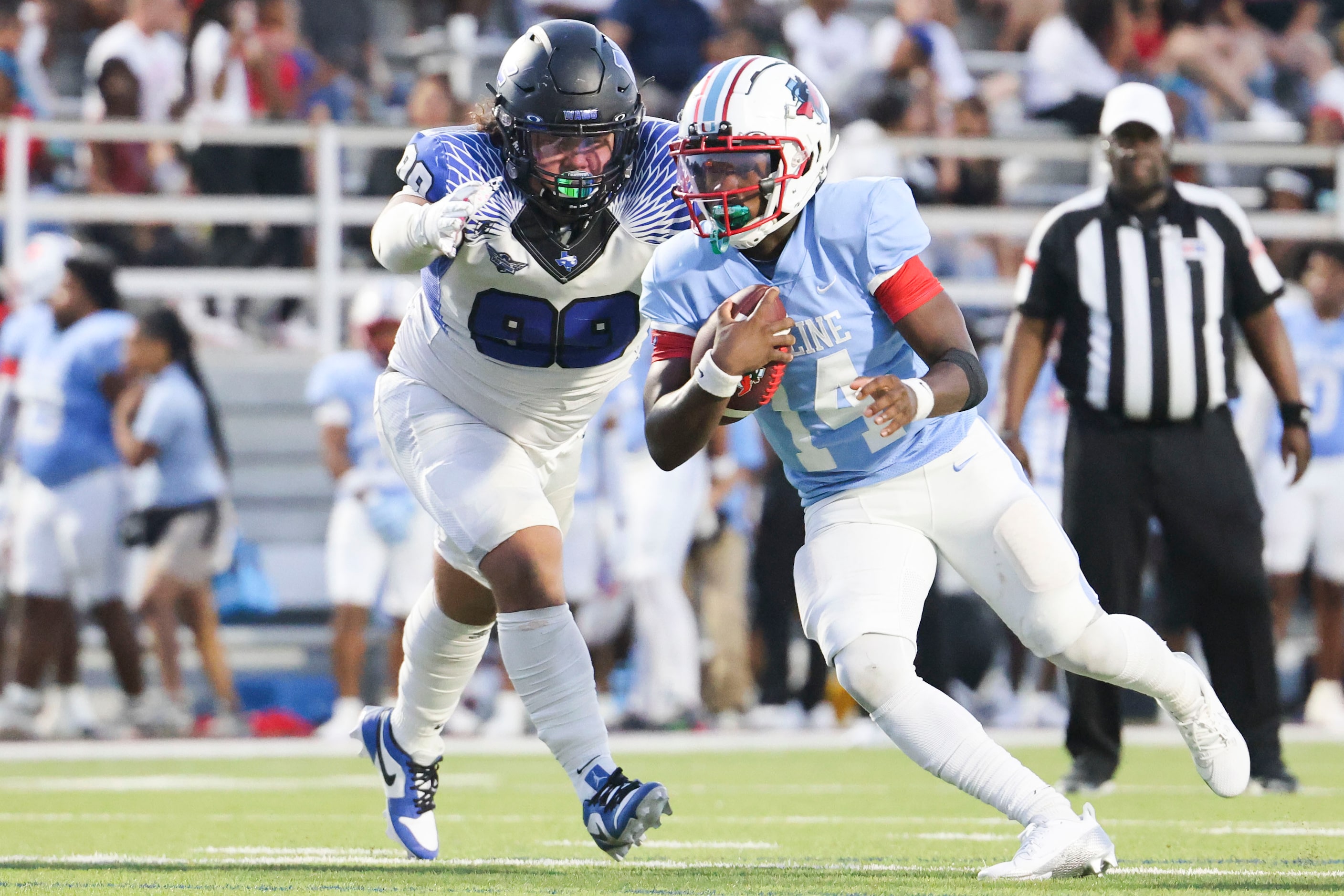 Skyline High’s quarterback Donte Ware (14) runs for a touchdown past North Forney High’s...