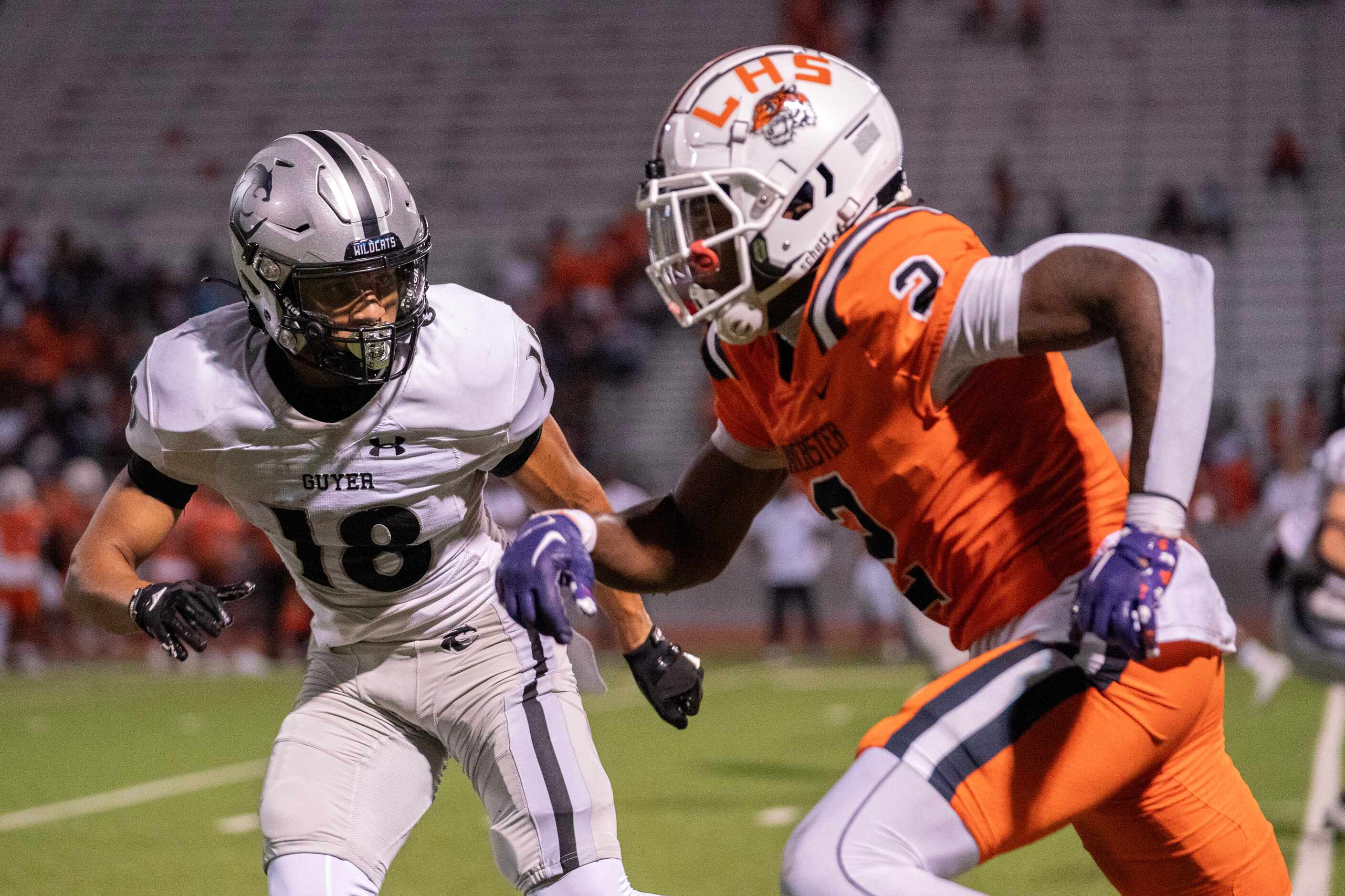 Denton Guyer senior defensive back Eli Bowen (18) covers Lancaster senior running back Kewan...