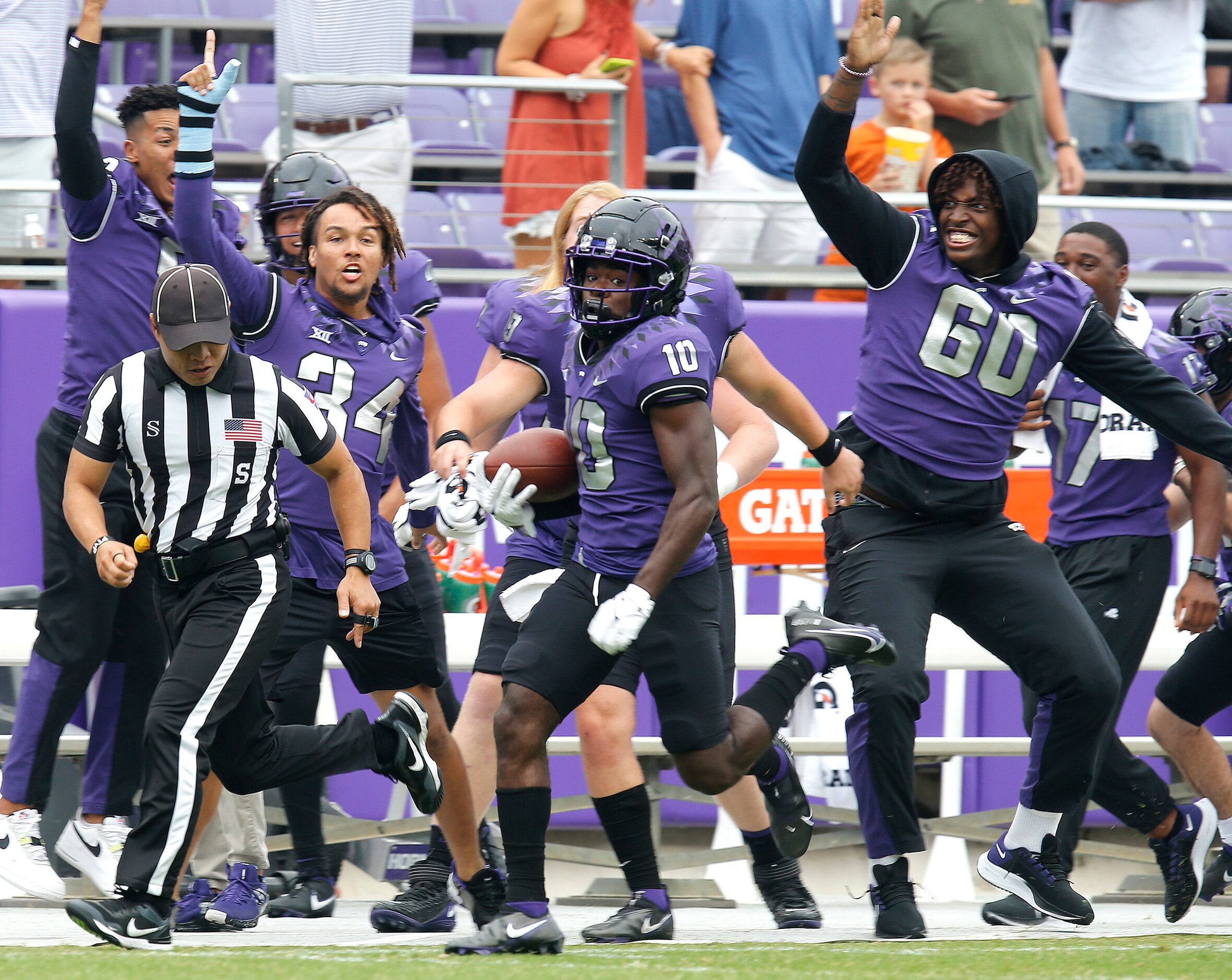 TCU Horned Frogs wide receiver JD Spielman (10) gets a return on the opening kickoff that...