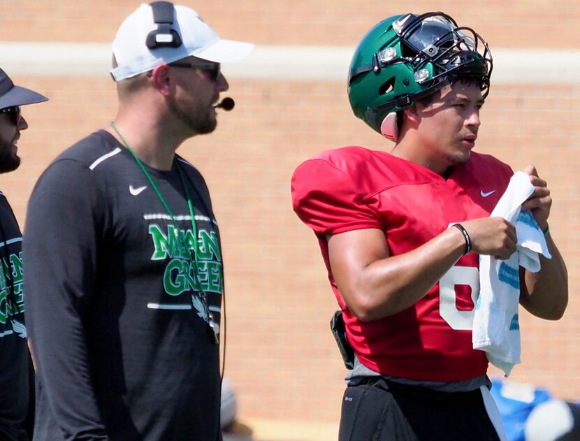 North Texas offensive coordinator Bodie Reeder, left, and quarterback Mason Fine attend...