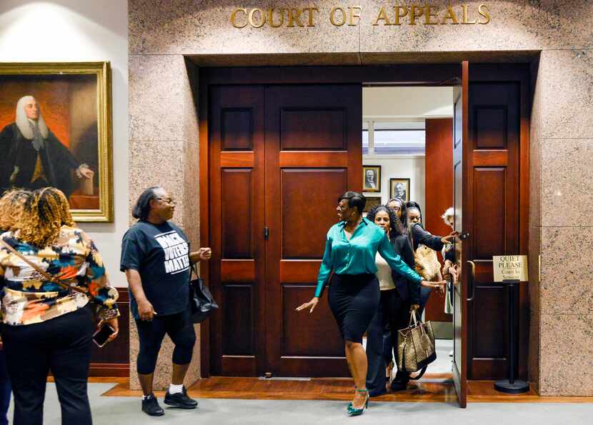 Crystal Mason (right) exits the Second Court of Appeals and greets supporters at the Tim...