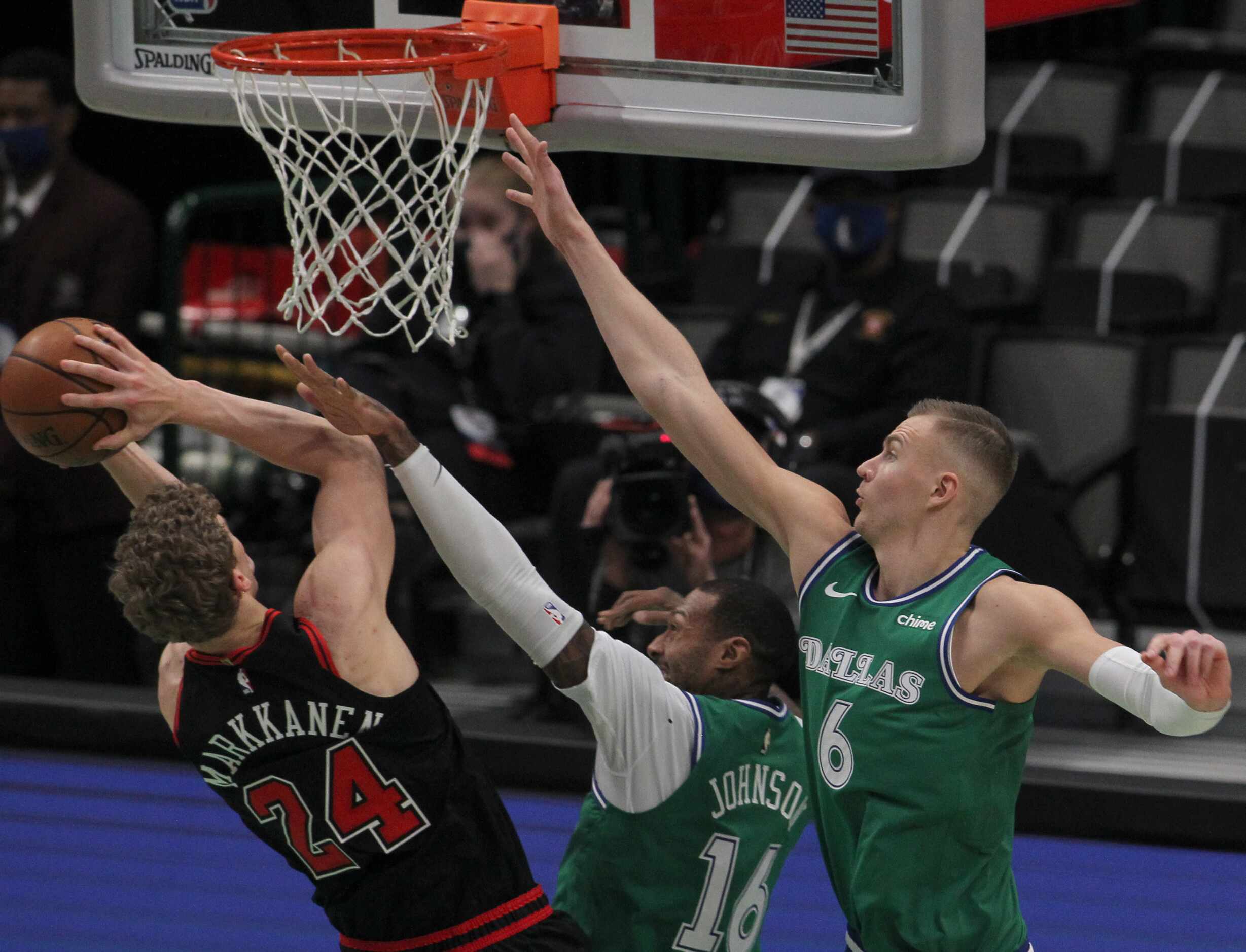 Chicago Bulls forward Lauri Markkanen (24) puts up a shot against the aggressive defense of...