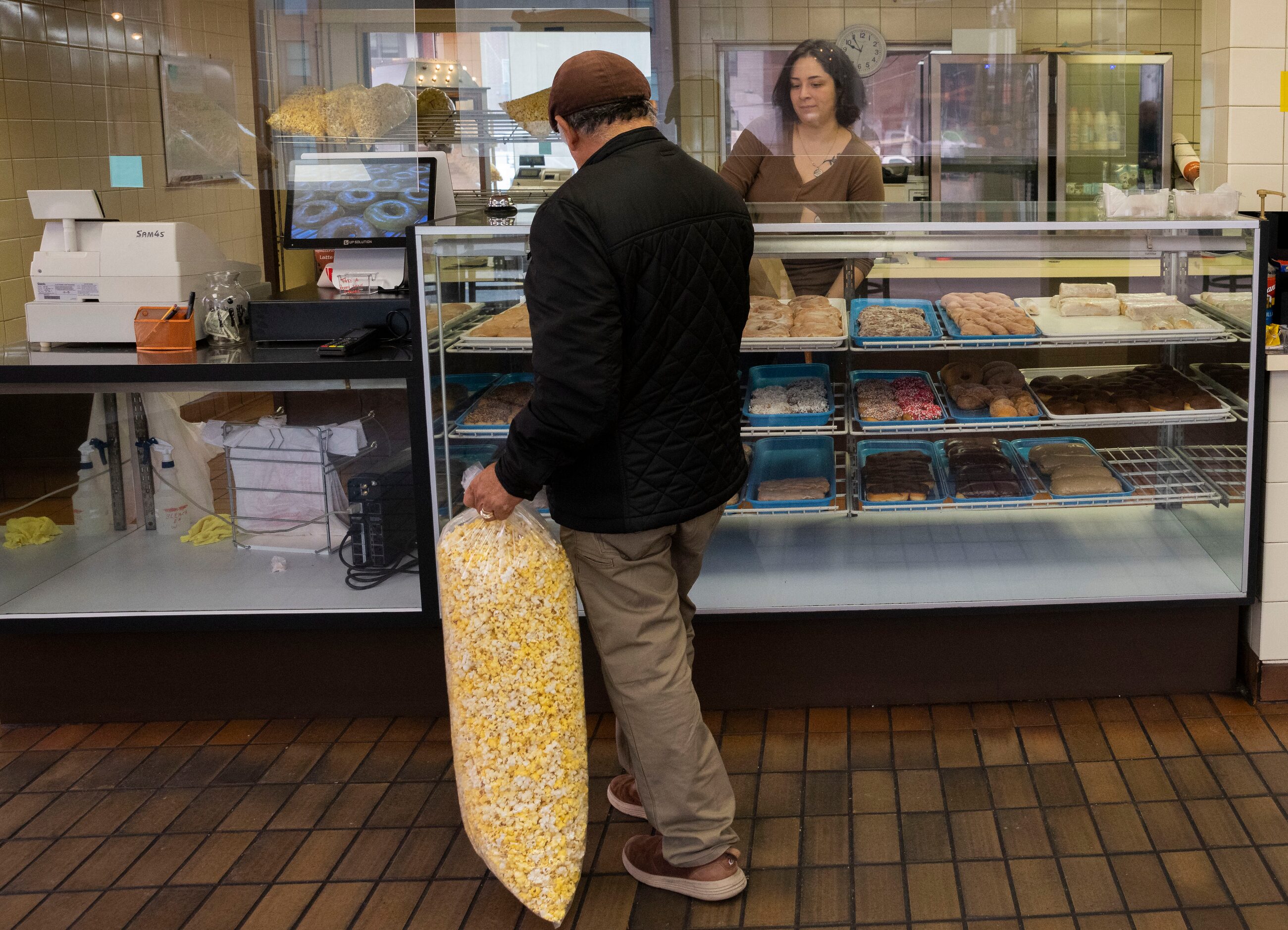 Restaurant manager Brianna Pantoja takes an order from a customer at Lone Star Donuts on...