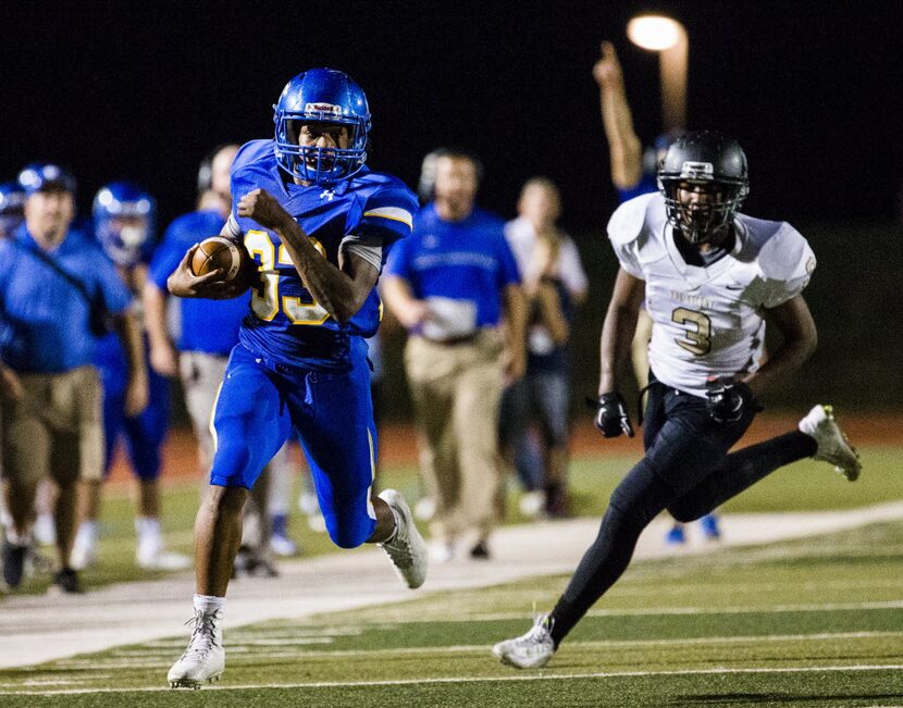 Frisco fullback Idrees Ali (33) runs toward the end zone, followed by The Colony strong...