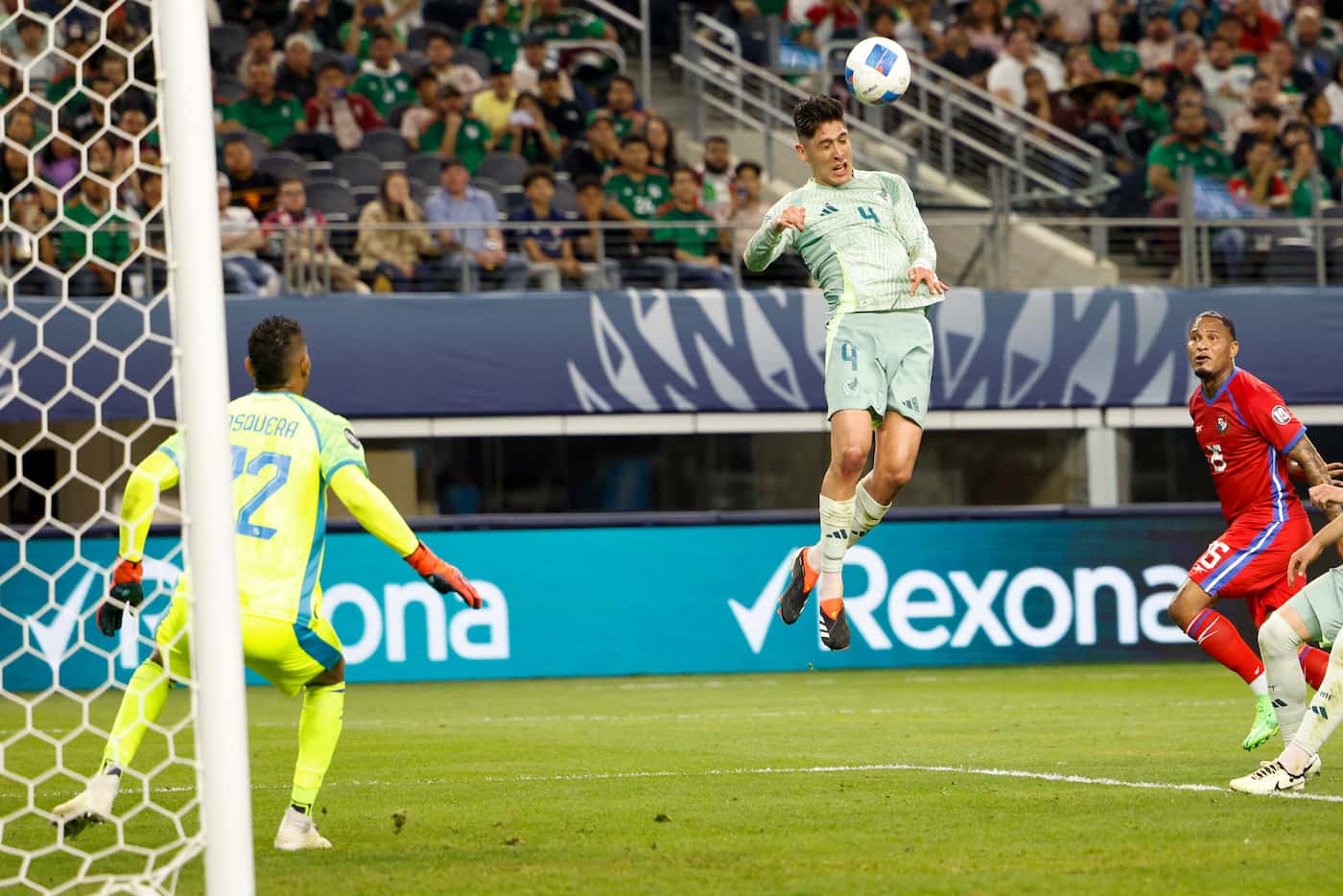 Mexico midfielder Edson Álvarez (4) heads the ball for a goal past Panama goalkeeper Orlando...