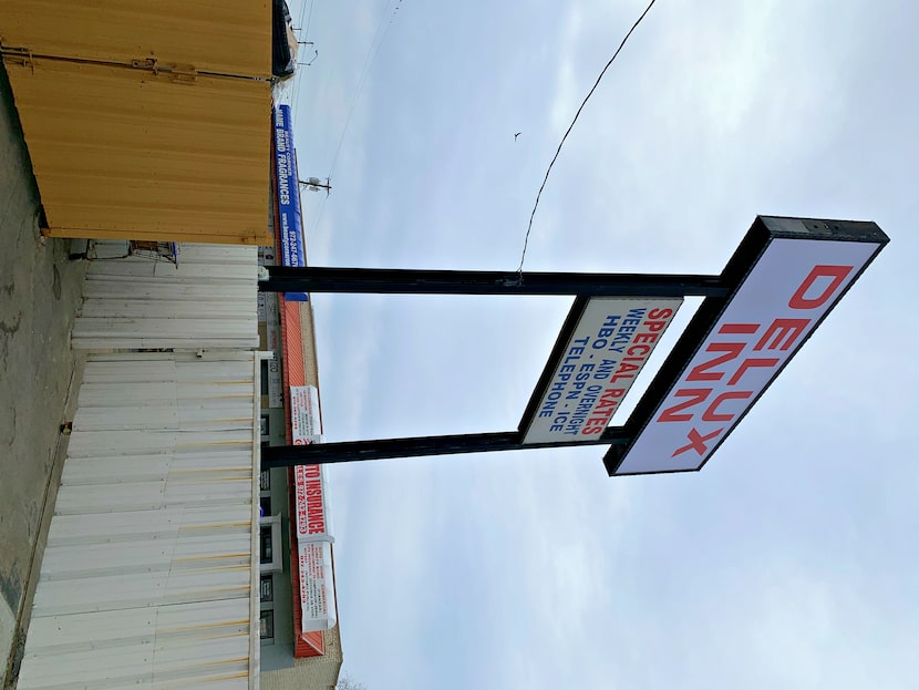 The motel's sign, amid the businesses of the Asian Trade District at Royal Lane and Harry...