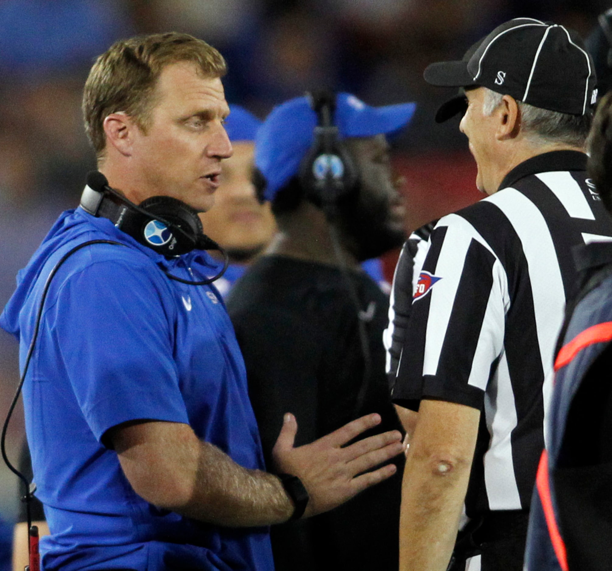 SMU Mustangs head coach Rhett Lashlee, left, confers with a game official during second half...