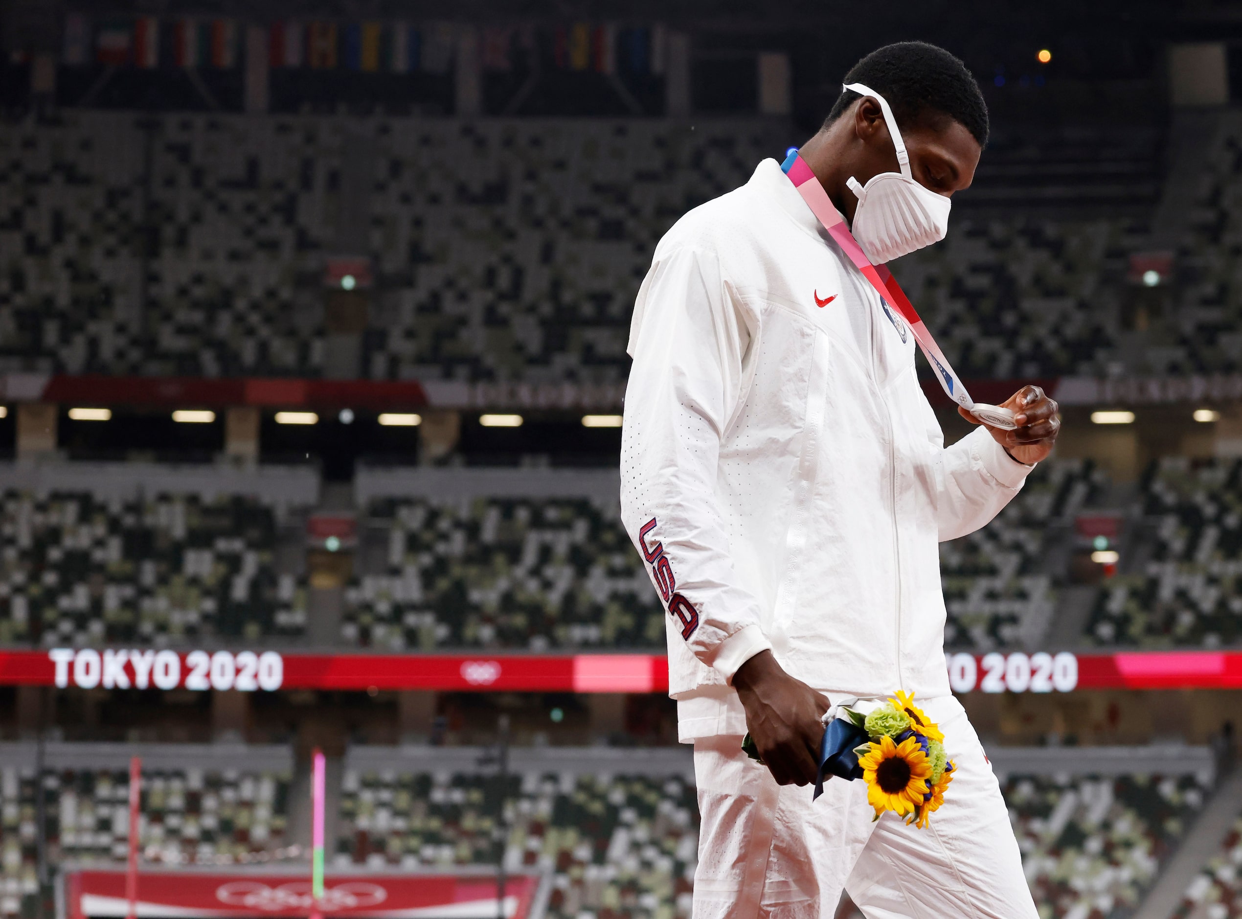 USA’s Fred Kerley takes a closer look at the silver medal he earned for his 9.84 second...