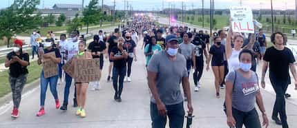 Black Lives Matter protesters march on Eldorado Pwy in Frisco on Monday evening, June 1, 2020.