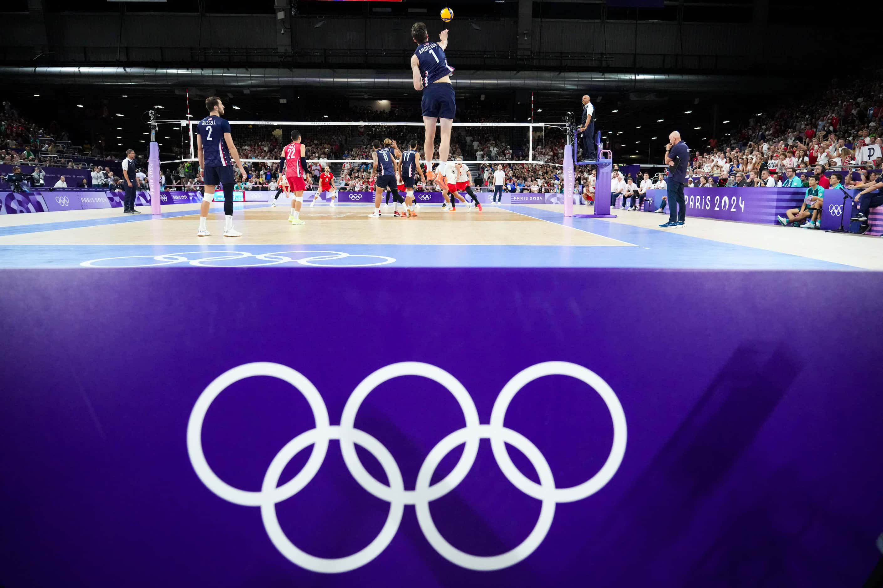 Matthew Anderson (1) of serves the ball during a men’s volleyball semifinal against Poland...