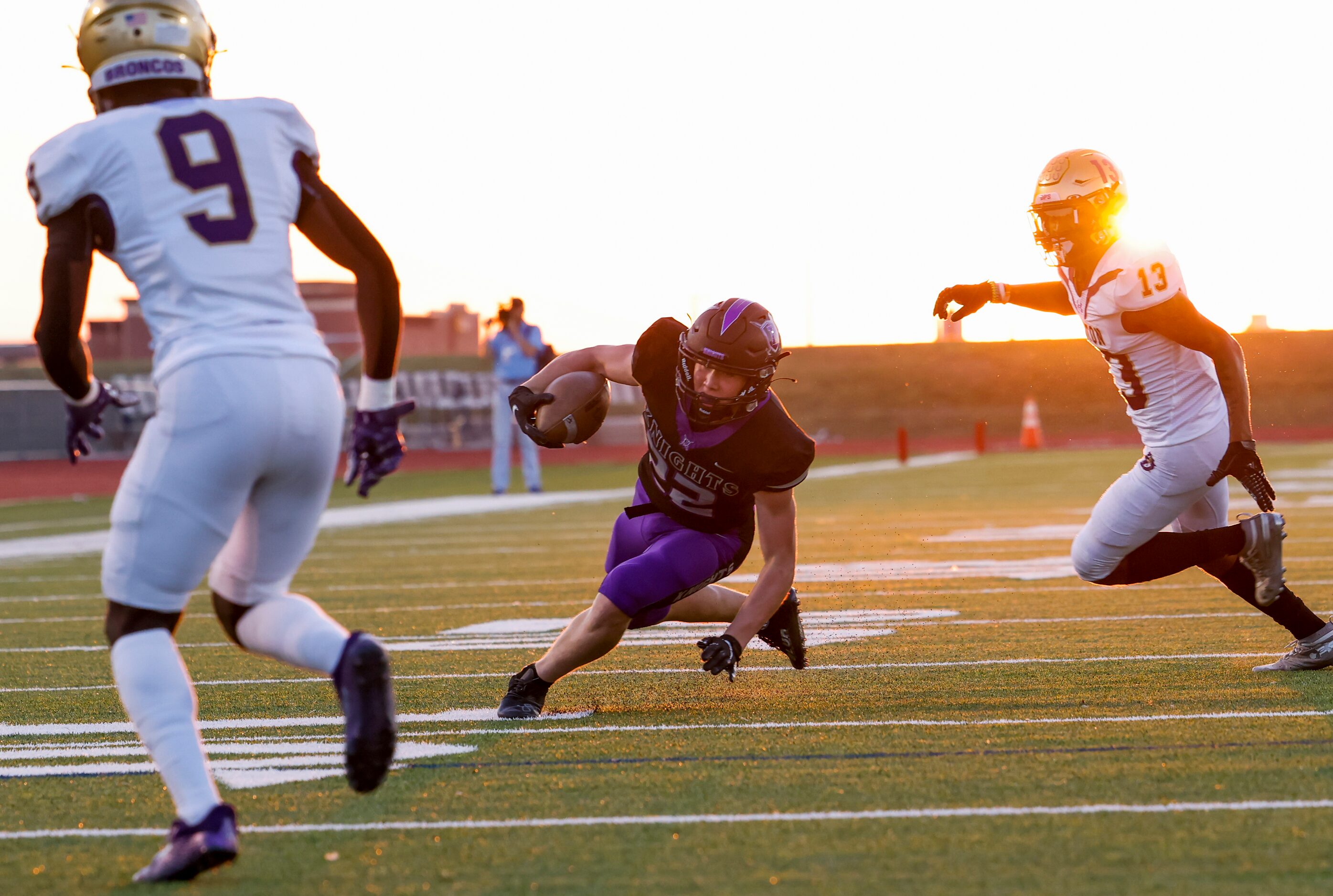 Frisco Independence’s Austin Call (22) evades Denton’s cornerback Kit Mongo (9) and strong...