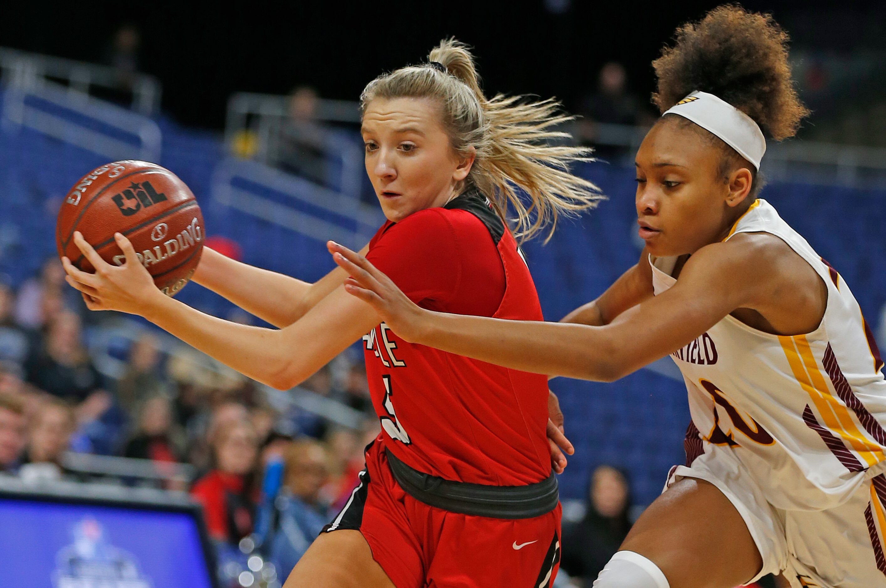 Argyle guard Rhyle McKinney #5 drives on Fairfield guard Shadasia Brackens #20 in a 4A final...